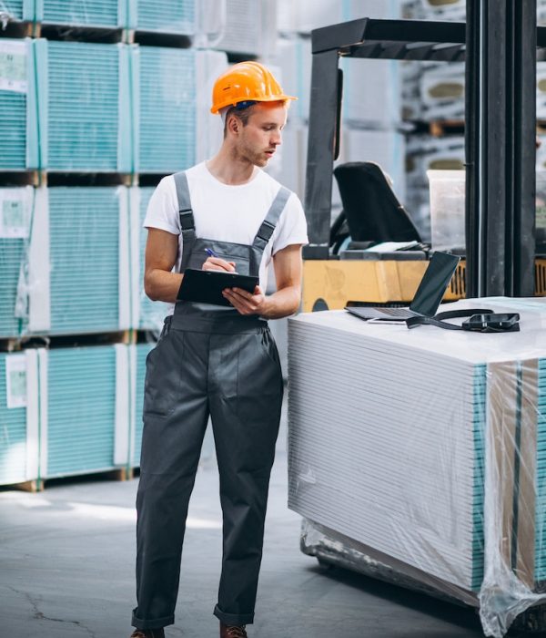 young-man-working-warehouse-with-boxes_1303-16638